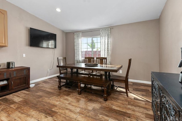 dining area with vaulted ceiling, recessed lighting, wood finished floors, and baseboards