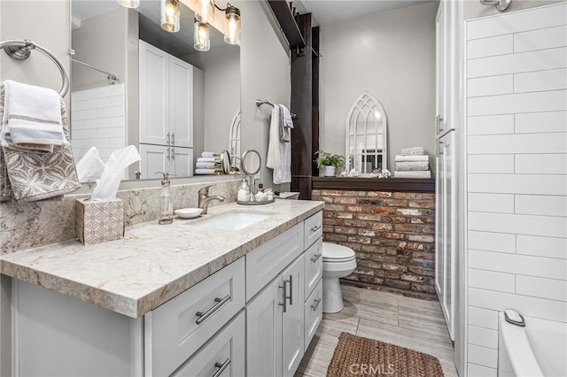 full bathroom with shower / tub combination, vanity, and toilet