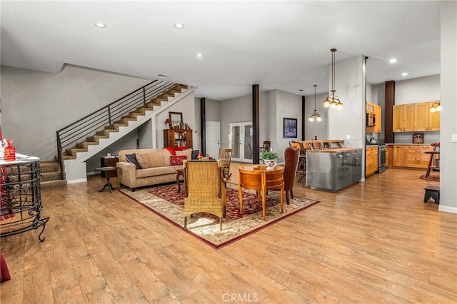 living room with light hardwood / wood-style flooring