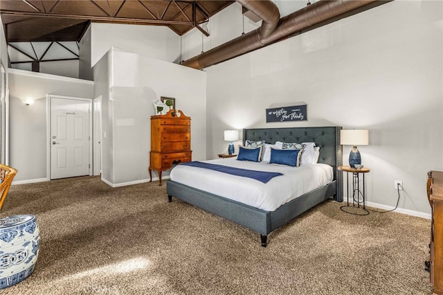 bedroom featuring a towering ceiling and carpet flooring