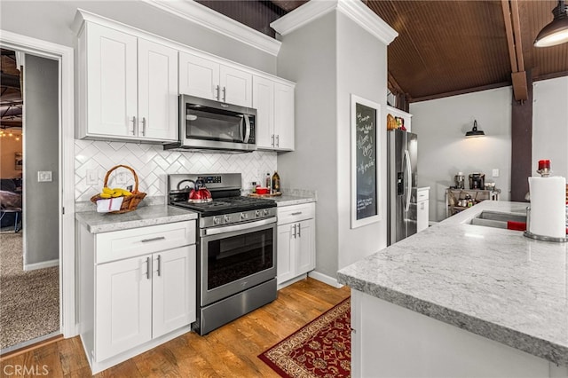 kitchen featuring white cabinetry, tasteful backsplash, light hardwood / wood-style flooring, wooden ceiling, and stainless steel appliances