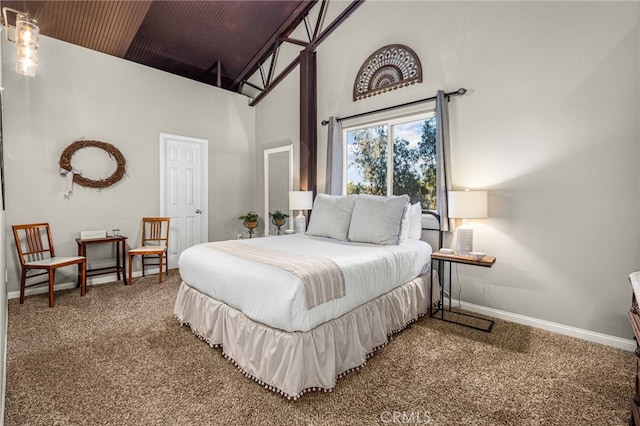 carpeted bedroom with a towering ceiling