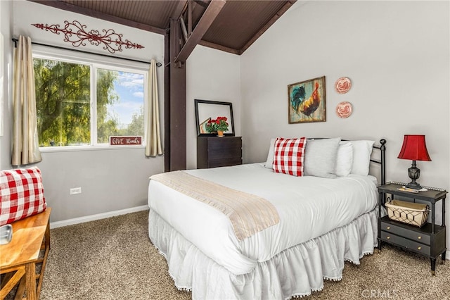 bedroom with vaulted ceiling and carpet floors