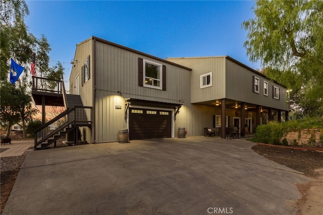 view of front of property with a garage and a deck