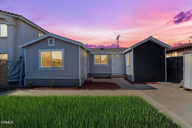 view of front of property with a yard