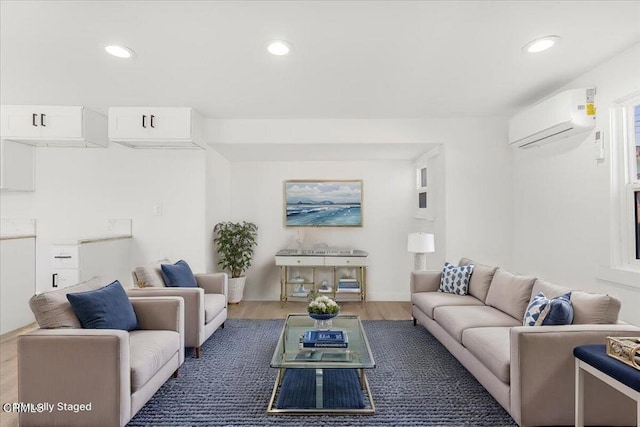 living room featuring a wall unit AC and dark hardwood / wood-style floors