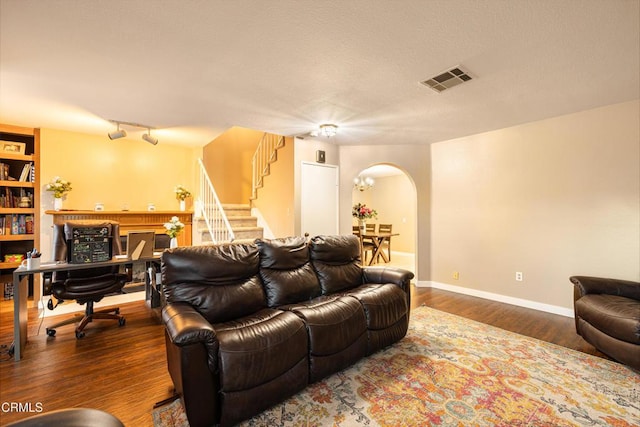 living room with dark hardwood / wood-style floors