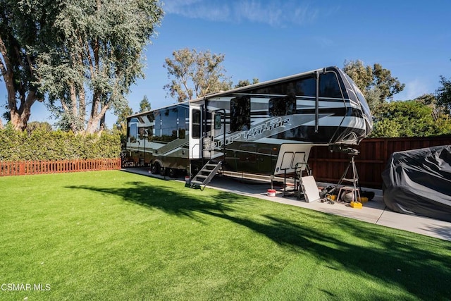 rear view of property with a yard