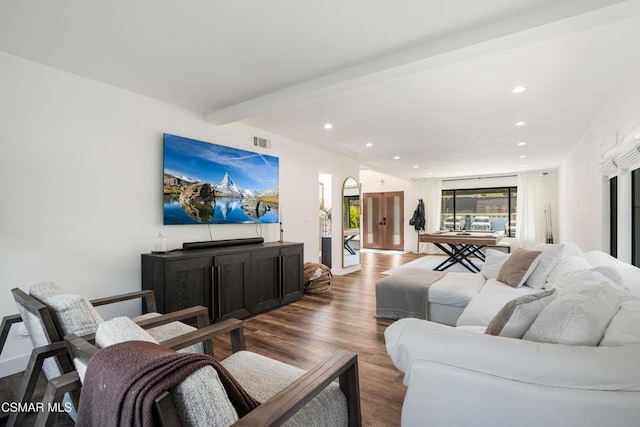 living room with hardwood / wood-style flooring and beam ceiling