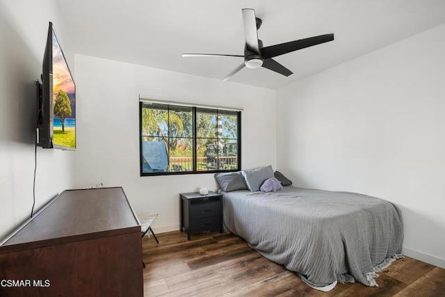 bedroom featuring dark wood-type flooring and ceiling fan