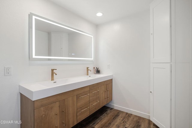 bathroom featuring hardwood / wood-style floors and vanity