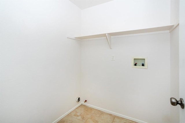 washroom featuring hookup for a gas dryer, hookup for a washing machine, and light tile patterned flooring