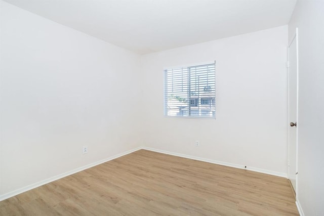 empty room with light wood-type flooring