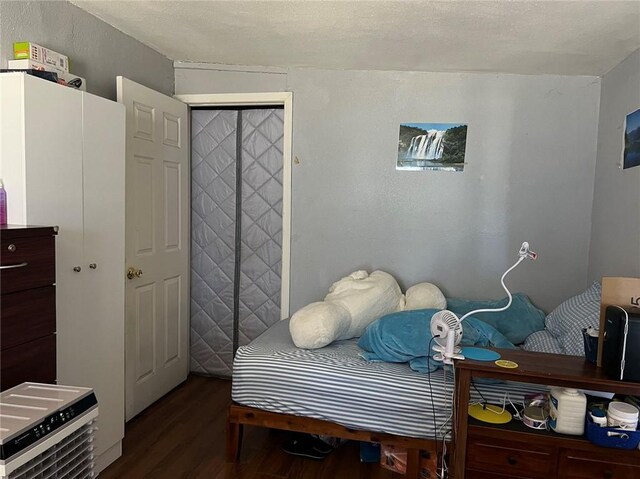 bedroom featuring dark wood-type flooring