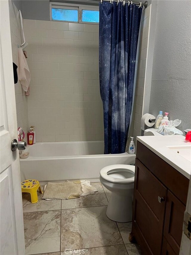 full bathroom featuring toilet, shower / tub combo with curtain, and vanity