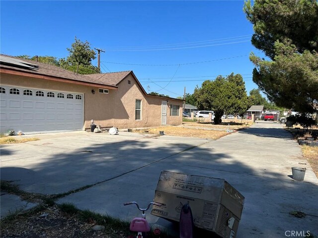 view of property exterior featuring a garage