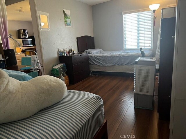 bedroom featuring dark hardwood / wood-style floors