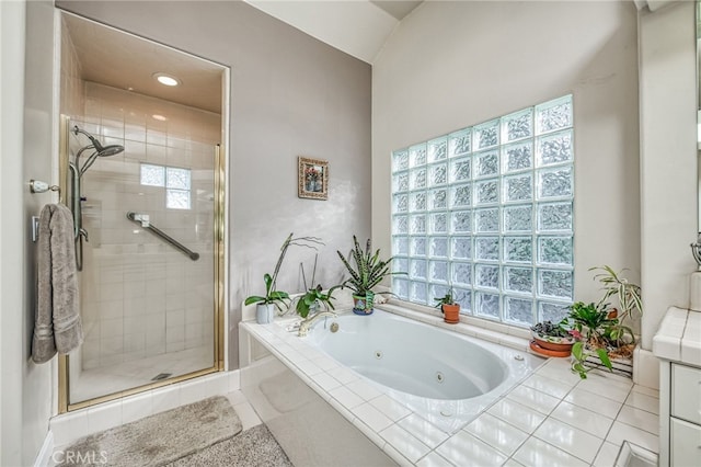 bathroom featuring tile patterned floors and independent shower and bath