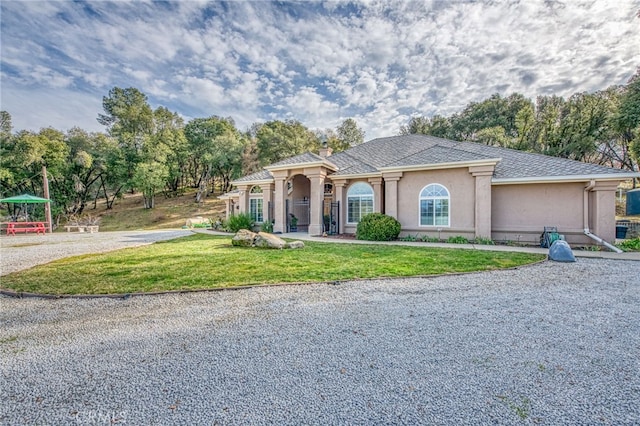 view of front of property with a front lawn