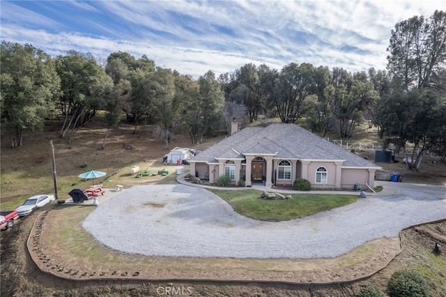 view of front of property with a garage and a front yard