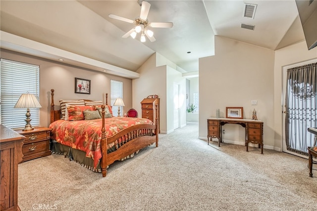 carpeted bedroom featuring ceiling fan and vaulted ceiling