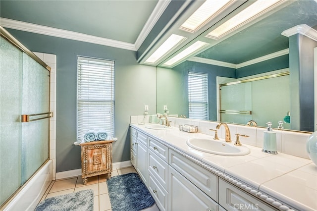 bathroom with tile patterned flooring, plenty of natural light, and crown molding