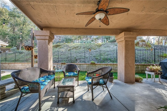 view of patio featuring ceiling fan and an outdoor living space