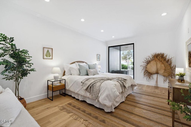 bedroom with recessed lighting, baseboards, light wood-style floors, and access to outside