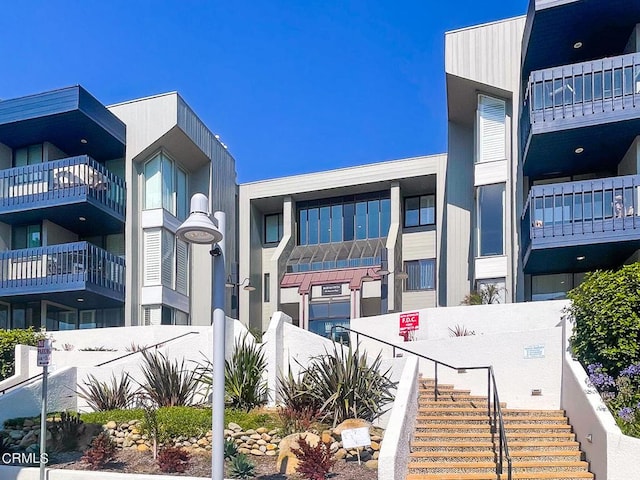 view of property featuring stairs