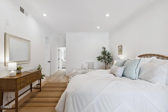 bedroom featuring recessed lighting, visible vents, wood finished floors, and ornamental molding