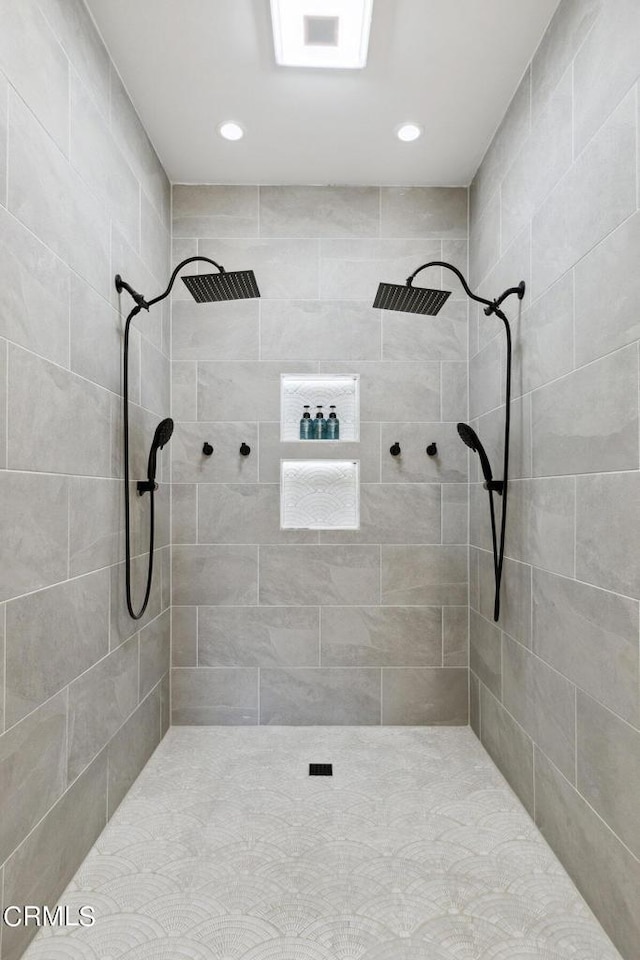 full bath with recessed lighting and tiled shower