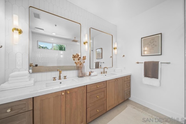 bathroom featuring vanity, decorative backsplash, and a shower