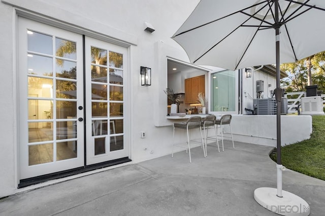 view of patio featuring french doors