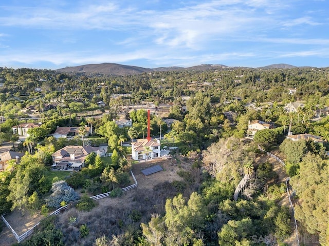 birds eye view of property with a mountain view