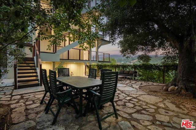 patio terrace at dusk with a balcony