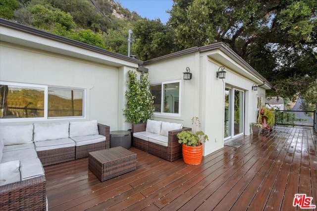 deck featuring outdoor lounge area