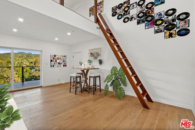 stairway featuring wood-type flooring