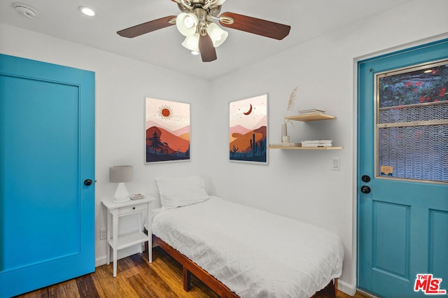 bedroom featuring ceiling fan and dark hardwood / wood-style flooring