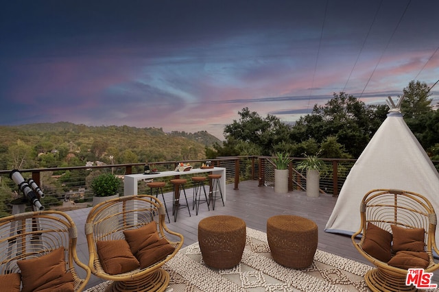 view of patio terrace at dusk