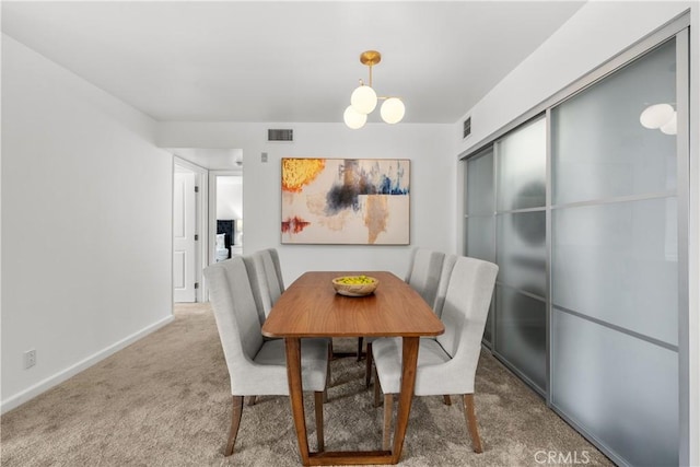 dining space featuring carpet flooring