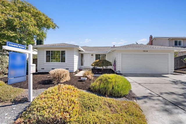 ranch-style home featuring a garage