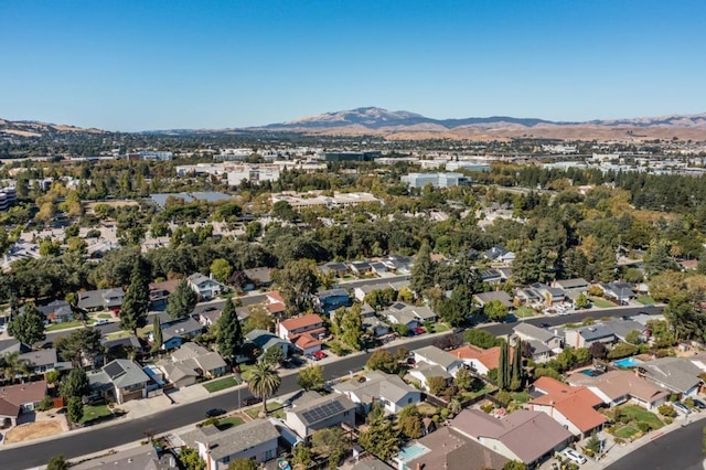 birds eye view of property with a mountain view