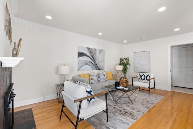 living room with crown molding and hardwood / wood-style flooring