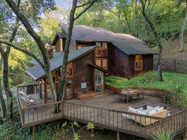 back of house featuring an outdoor hangout area and a deck