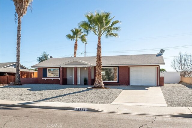 ranch-style home featuring a garage