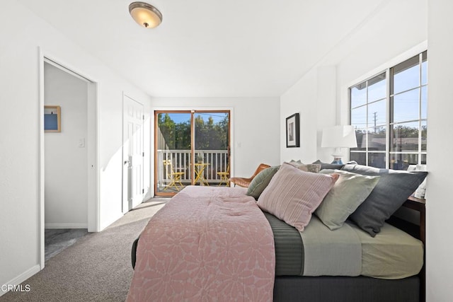 carpeted bedroom featuring access to exterior