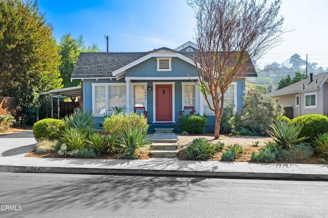 bungalow-style home with a carport