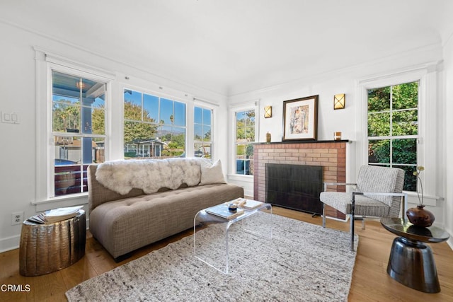 sunroom / solarium featuring a fireplace