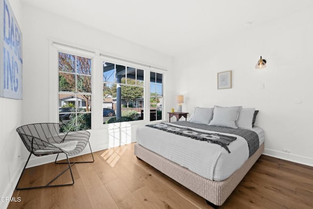 bedroom with hardwood / wood-style floors