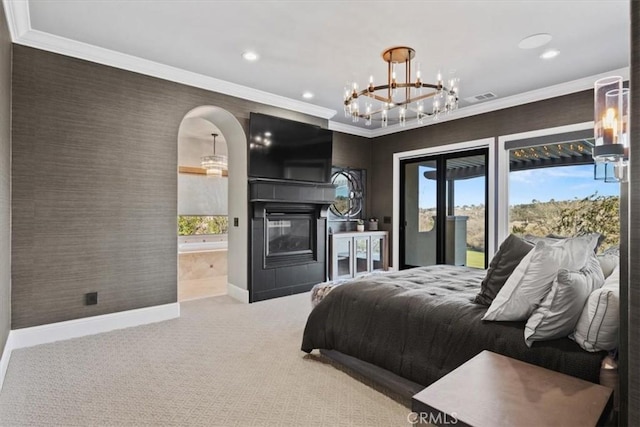 carpeted bedroom with access to outside, ensuite bath, and crown molding